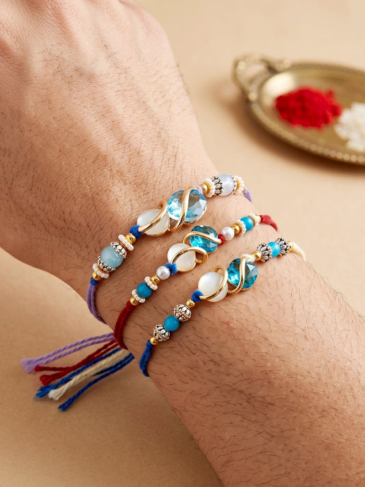 Designer Rakhi Set of 3: Blue Crystal, Cream Stone, Metallic Spacers, Roli, Chawal & Card (300-CHR1-1002A-3-2026)