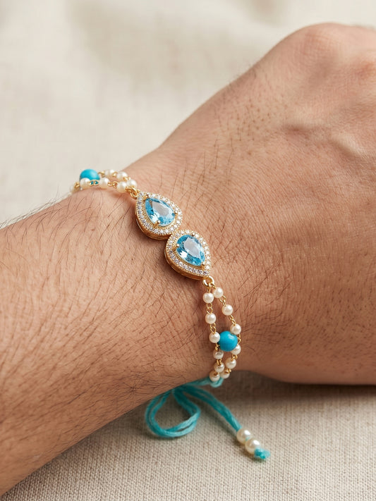 Adjustable Rakhi Bracelet with Blue drop AD Pendant, Turquoise & White Beads on Double Chain (200-CHB2-1279-F-2026)