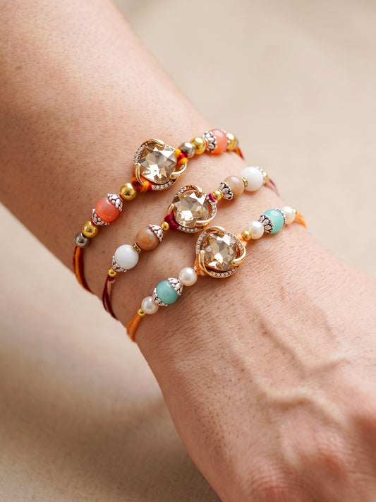 Set of 3 Designer Rakhis: Faceted Crystal Centerpiece & Multi Beads, Roli, Chawal & Card (300-CHR1-1002B-3-2026)