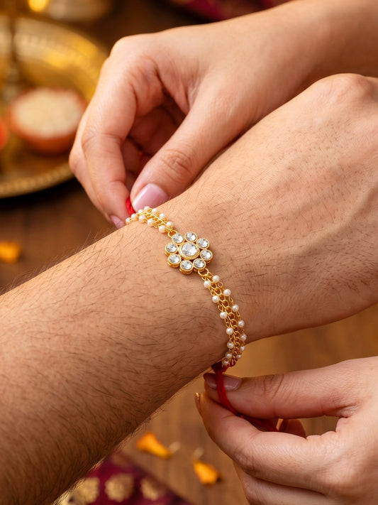 LUCKY JEWELLERY Traditional Rakhi for Brother/Bhaiya – Gold Plated Red Thread Rakshabandhan Rakhie in White Stones for Bhai/Bhabhi (Pack of 1) – Fancy Rakhee Bracelet Rakshasutra (99-L1R1-26-W-1-2026)