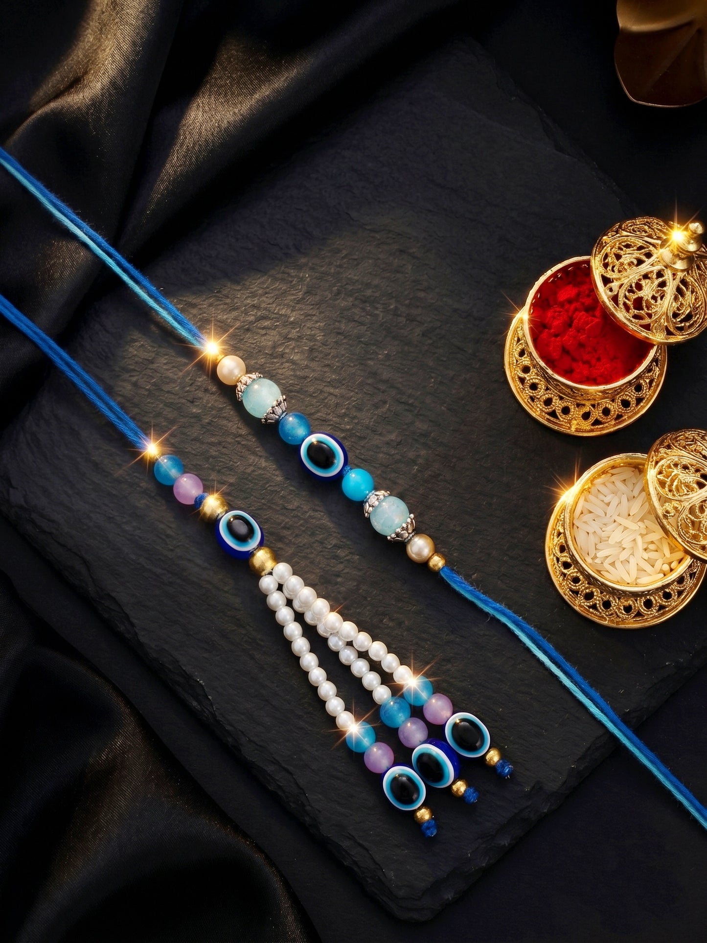 Set of 2 Bhaiya Bhabhi Evil Eye Rakhi Set with Blue & White Beads, Lumba Tassel, Roli Chawal & Card (75-J5R1-1993-EE-2-2026)