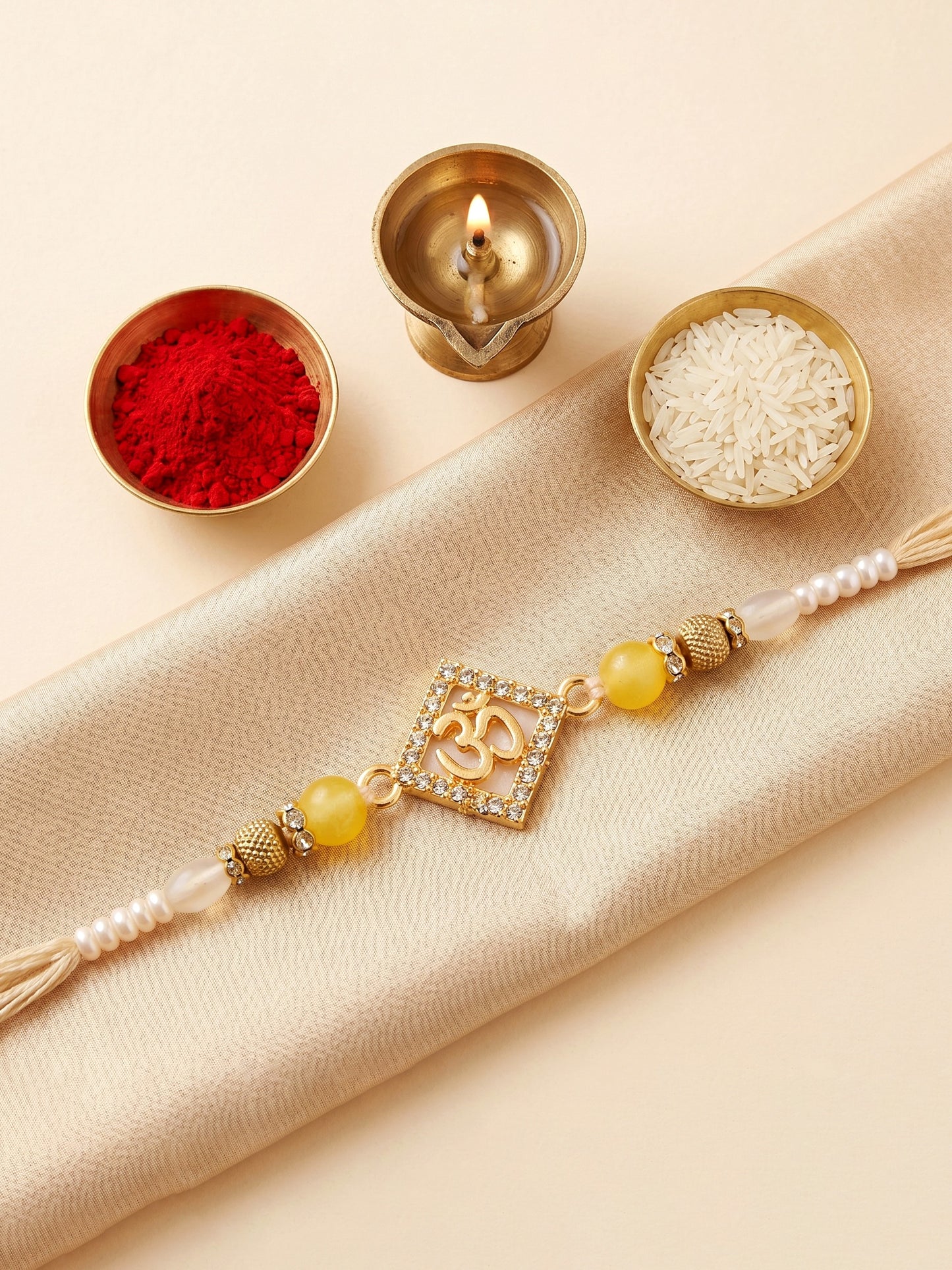 Designer Square Om Rakhi For Brother With Roli Chawal And Card | Gold-Tone Rhinestone Studded Rakhi (100-S7R1-IO3801)