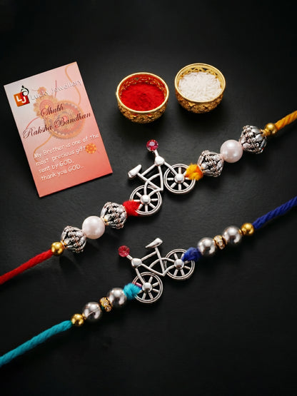 Set of 2 Silver Bicycle Rakhi for Brother with White & Metallic Beads, Roli Chawal & Card (72-JPR1-1954-S-2-2026)