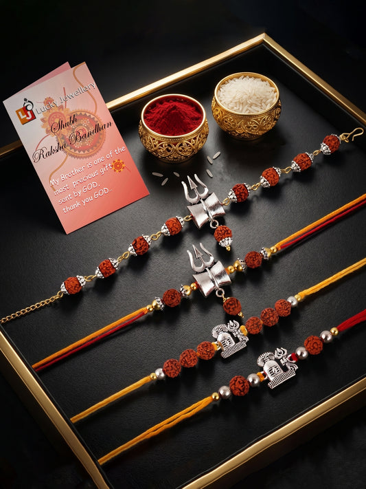 Set of 4 Rakhi with Trishul & Shivling Pendants, Rudraksha Beads, Roli Chawal & Card (220-CHR1-196372-4-2026)