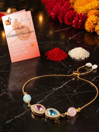 Adjustable Rakhi Bracelet with Blue & Pink drop AD Pendant,Pastel Beads,Roli Chawal & Card (209-CHB2-1279-PKF-2026)