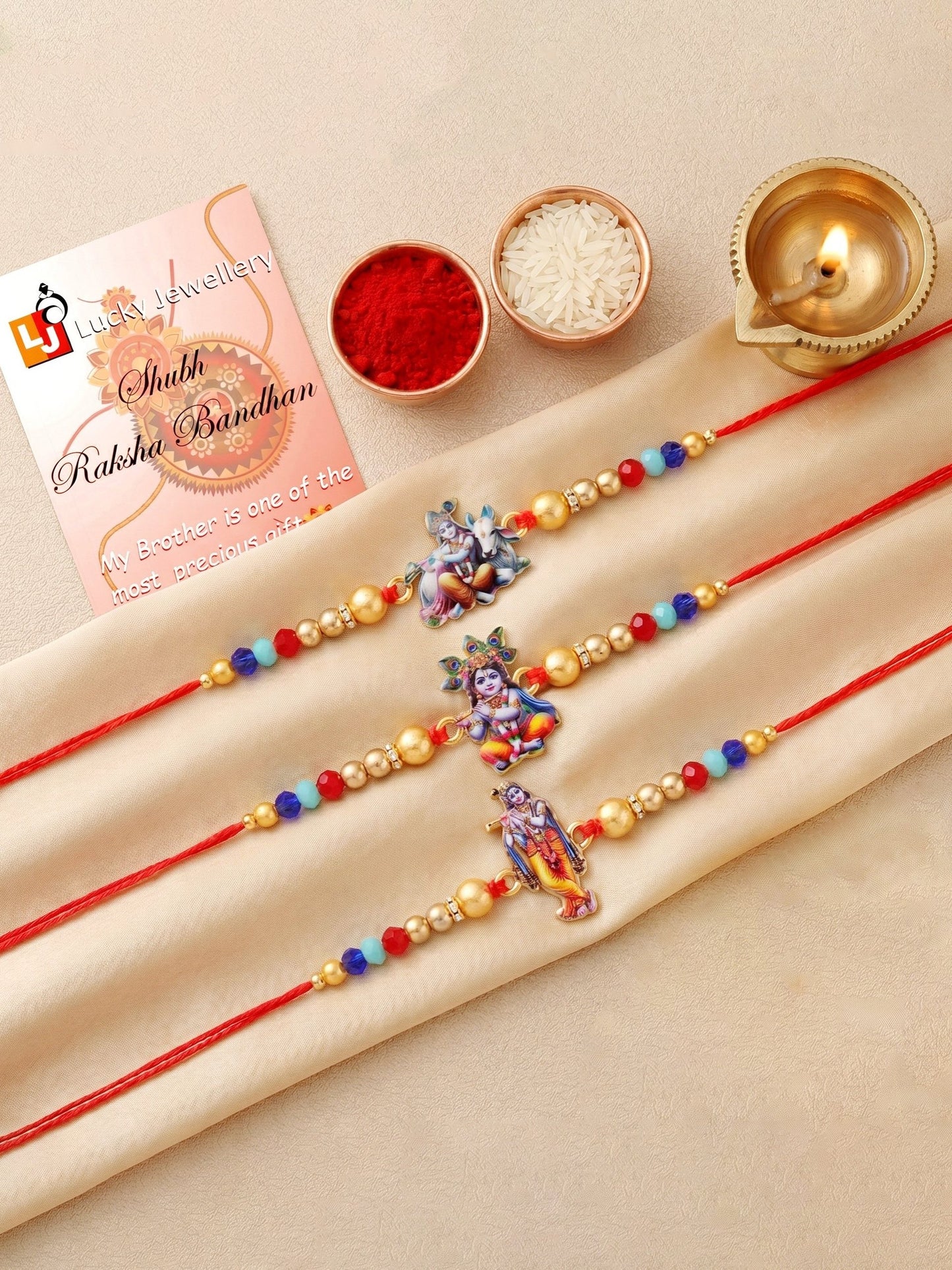 Designer Krishna Rakhi Set of 3 for Bhai | Traditional Red Thread with Golden & Colored Beads | Raksha Bandhan Gift Pack with Roli Chawal Card (252-S5R1-2310-3)