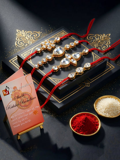 LUCKY JEWELLERY Traditional Rakhi for Brother/Bhaiya – Gold Plated Red Thread Rakshabandhan Rakhie White Stones for Bhai/Bhabhi (Pack of 4) – Fancy Rakhee Bracelet Rakshasutra (159-L1R1-02-W-4-2026)