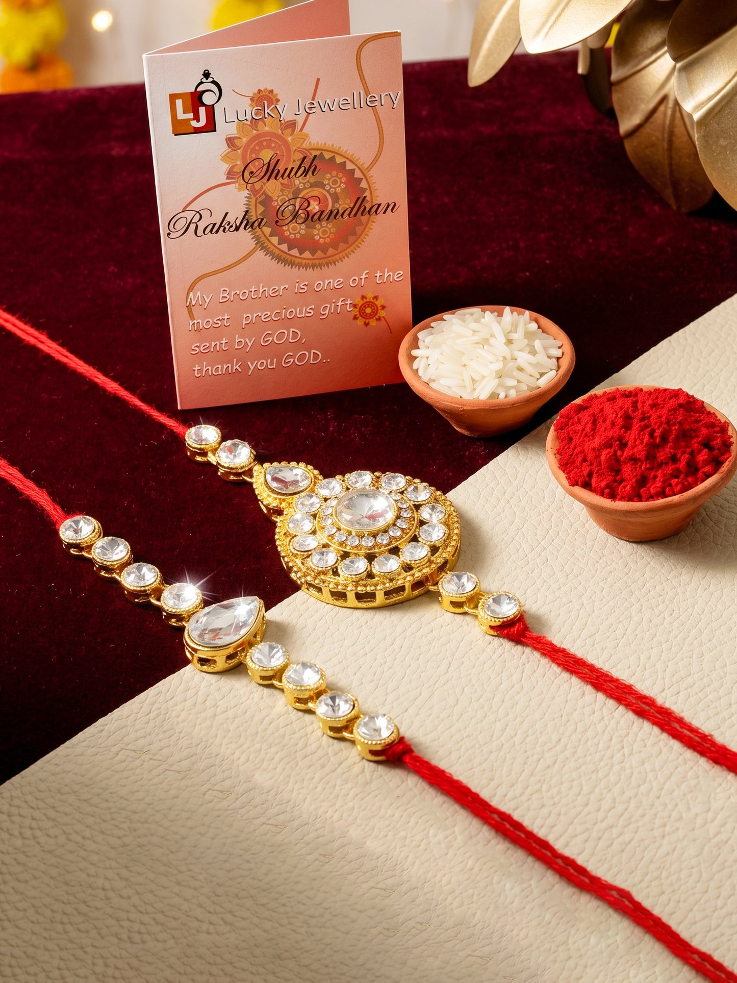 LUCKY JEWELLERY Traditional Rakhi for Brother/Bhaiya – Gold Plated Red Thread Rakshabandhan Rakhie White Stones for Bhai/Bhabhi (Pack of 2) – Fancy Rakhee Bracelet Rakshasutra (159-L1R1-21-W-2-2026)