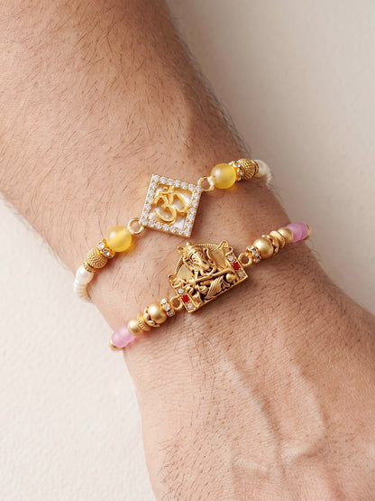 Lucky Jewellery Set of 2 Rakhi with Om & Ganesha Pendants, Pink & Smooth White Beads, Roli Chawal & Card (188-S7R1-2316-2)