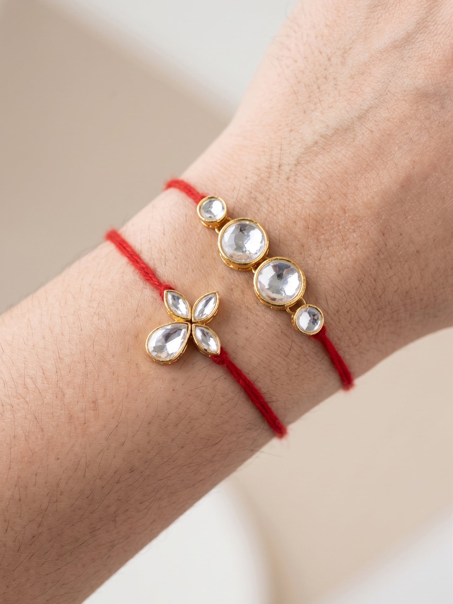 LUCKY JEWELLERY Traditional Rakhi for Brother/Bhaiya – Gold Plated Red Thread Rakshabandhan Rakhie in White Stones for Bhai/Bhabhi (Pack of 2) – Fancy Rakhee Rakshasutra (152-L1R1-06-10-W-2-2026)