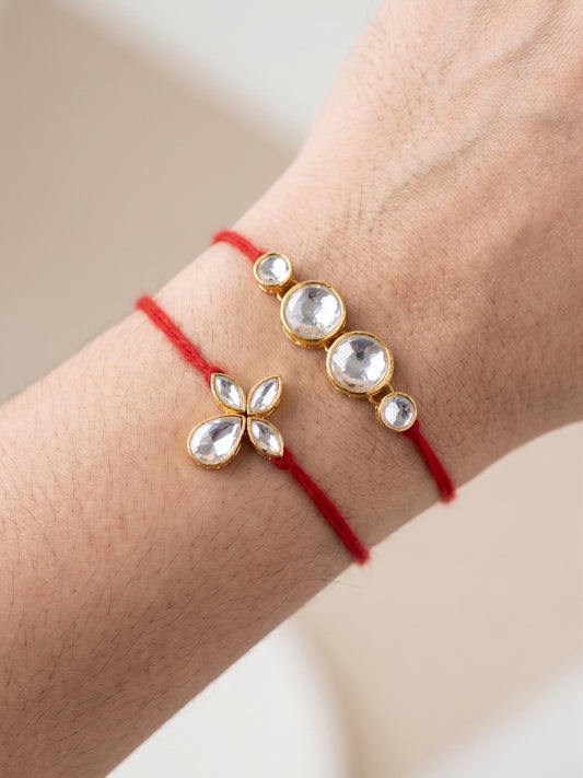 LUCKY JEWELLERY Traditional Rakhi for Brother/Bhaiya – Gold Plated Red Thread Rakshabandhan Rakhie in White Stones for Bhai/Bhabhi (Pack of 2) – Fancy Rakhee Rakshasutra (152-L1R1-06-10-W-2-2026)