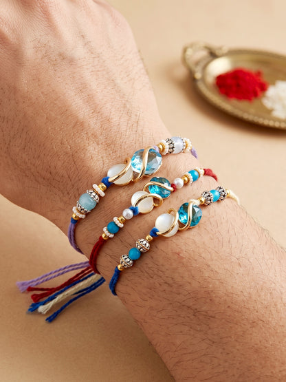 Designer Rakhi Set of 3: Blue Crystal, Cream Stone, Metallic Spacers, Roli, Chawal & Card (300-CHR1-1002A-3-2026)