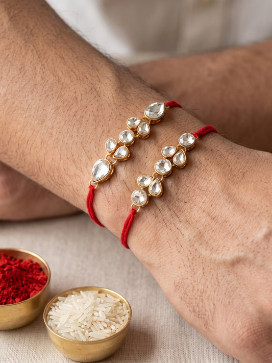LUCKY JEWELLERY Traditional Rakhi for Brother/Bhaiya – Gold Plated Red Thread Rakshabandhan Rakhie White Stones for Bhai/Bhabhi (Pack of 2) – Fancy Rakhee Bracelet Rakshasutra (159-L1R1-07-W-2-2026)