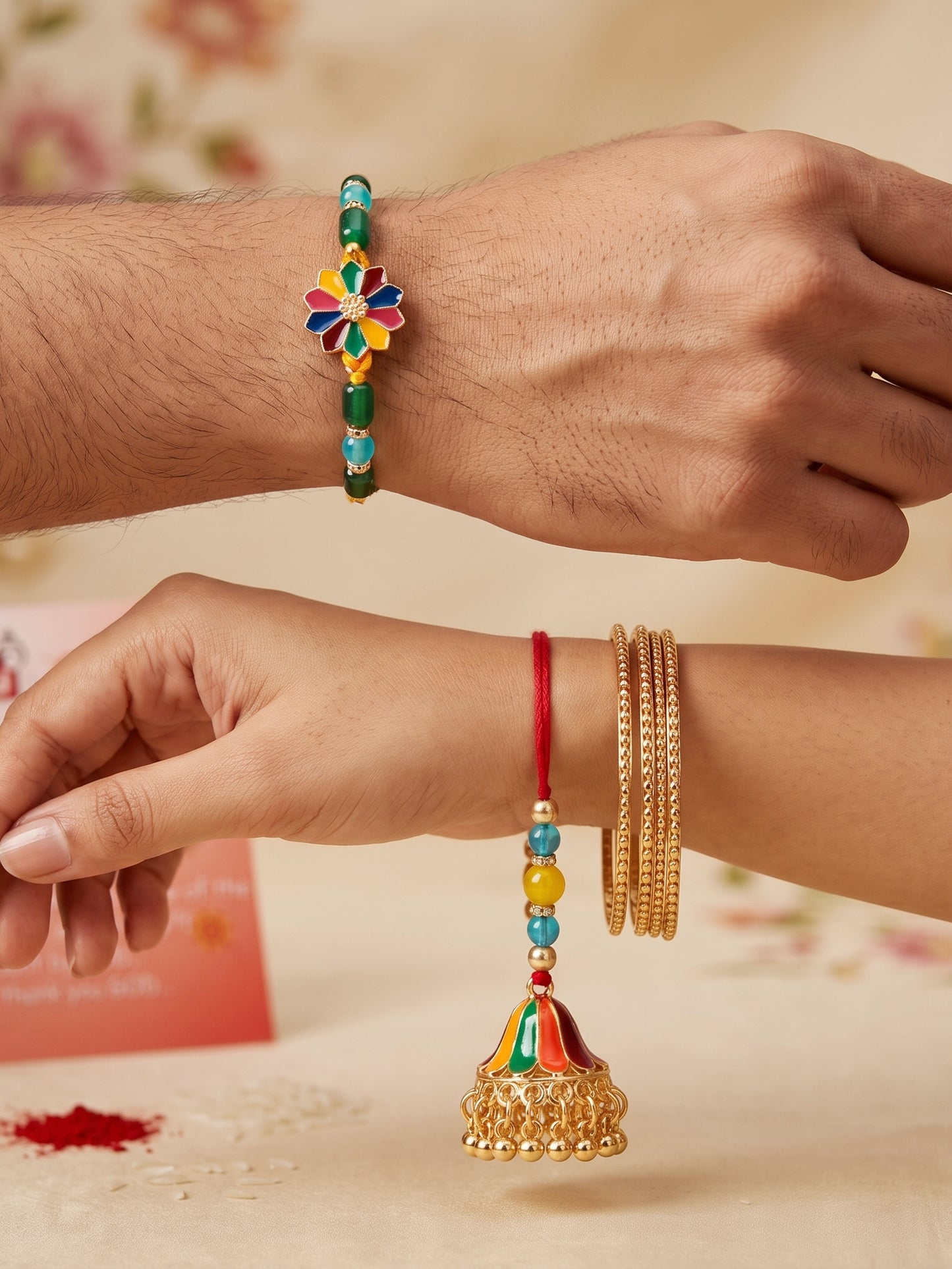 Set of 2 Bhaiya Bhabhi Rakhi Set with Floral Centerpiece & Jhumka Lumba, Roli Chawal & Card (240-CHCR1-1146-MT-2-2026)