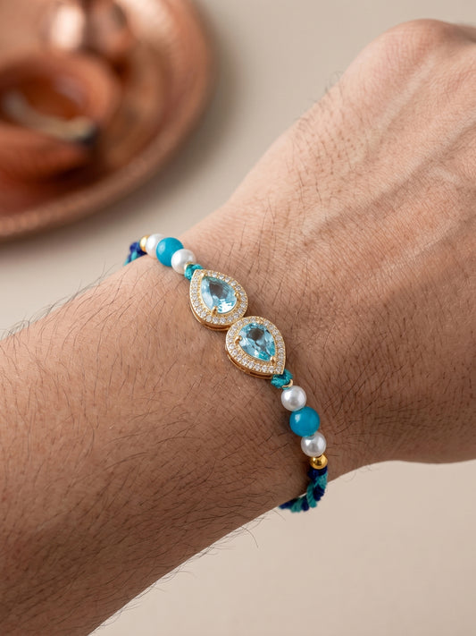 Rakhi for Brother with Blue drop AD Pendant, Smooth White Beads, Roli Chawal & Card (176-CHR1-1279-FB-1-2026)