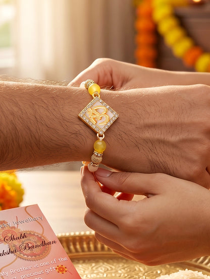 Designer Square Om Rakhi For Brother With Roli Chawal And Card | Gold-Tone Rhinestone Studded Rakhi (100-S7R1-IO3801)