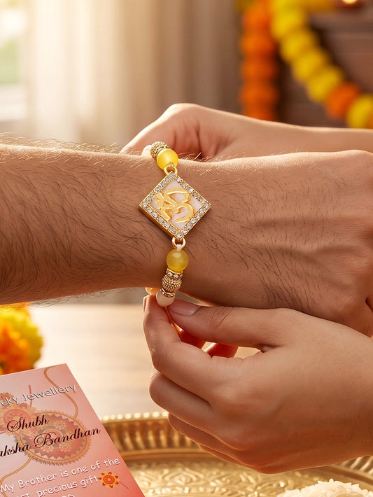 Designer Square Om Rakhi For Brother With Roli Chawal And Card | Gold-Tone Rhinestone Studded Rakhi (100-S7R1-IO3801)