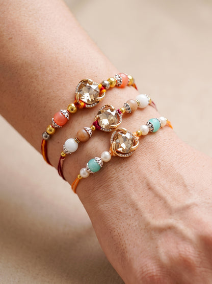 Set of 3 Designer Rakhis: Faceted Crystal Centerpiece & Multi Beads, Roli, Chawal & Card (300-CHR1-1002B-3-2026)