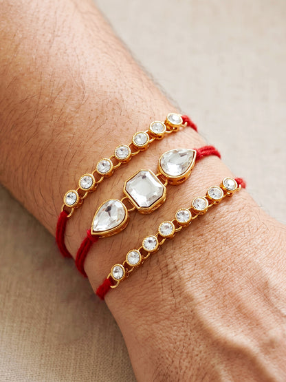 LUCKY JEWELLERY Traditional Rakhi for Brother/Bhaiya – Gold Plated Red Thread Rakshabandhan Rakhie White Stones for Bhai/Bhabhi (Pack of 3) – Fancy Rakhee Bracelet Rakshasutra (159-L1R1-08-W-3-2026)