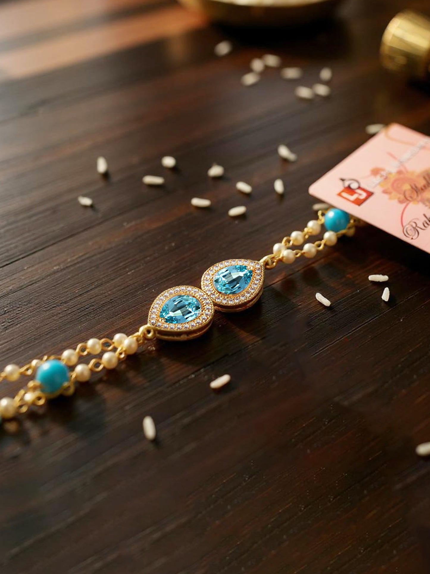 Lucky Jewellery Designer Turquoise Color Stone Rakhi - Rakshabandhan Rakhee Bracelet Pearl Lumba for Bhabhi/Girls & Women with Pull Chain Pack of 1 (233-CHB2-1279-F)