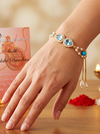 Adjustable Rakhi Bracelet with Blue drop AD Pendant, Turquoise & Beads,Roli Chawal & Card (233-CHB2-1279-F-2026)