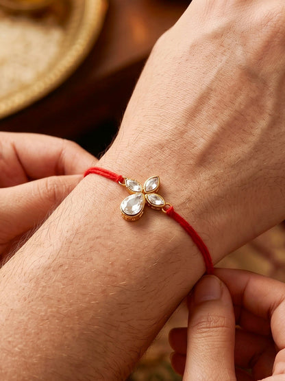 LUCKY JEWELLERY Traditional Rakhi for Brother/Bhaiya – Gold Plated Red Thread Rakshabandhan Rakhie in White Stones for Bhai/Bhabhi (Pack of 1) – Fancy Rakhee Bracelet Rakshasutra (76-L1R1-06-W-1-2026)