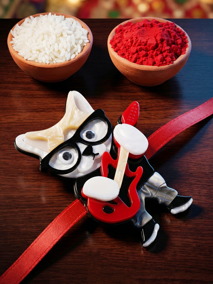 Kids Rakhi: Cute Rockstar Cat Playing Guitar Acrylic Charm on Red Ribbon, Roli, Chawal & Card (440-CHR1-1192-1-2026)