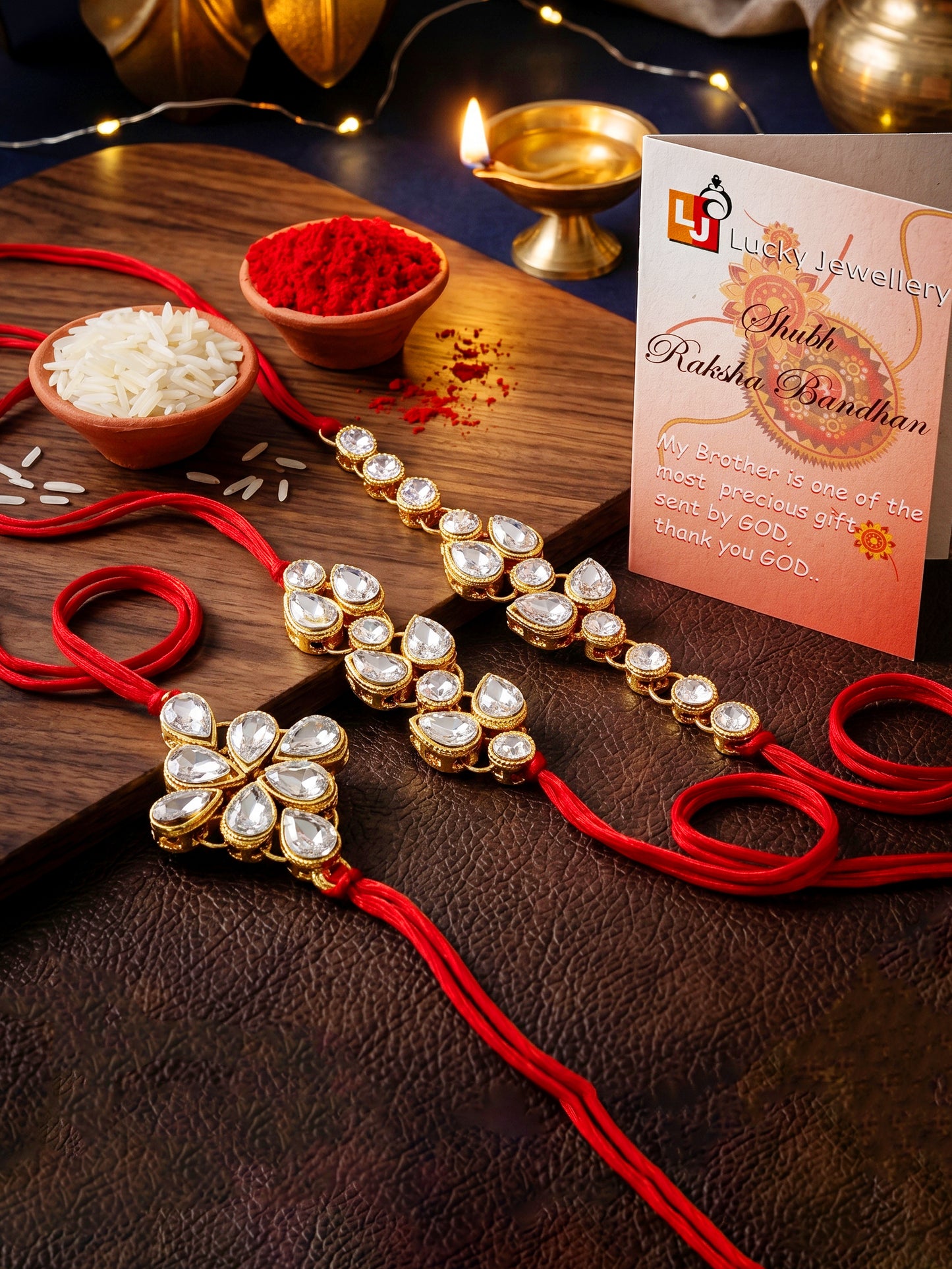 LUCKY JEWELLERY Traditional Rakhi for Brother/Bhaiya – Gold Plated Red Thread Rakshabandhan Rakhie White Stones for Bhai/Bhabhi (Pack of 3) – Fancy Rakhee Bracelet Rakshasutra (159-L1R1-09-W-3-2026)
