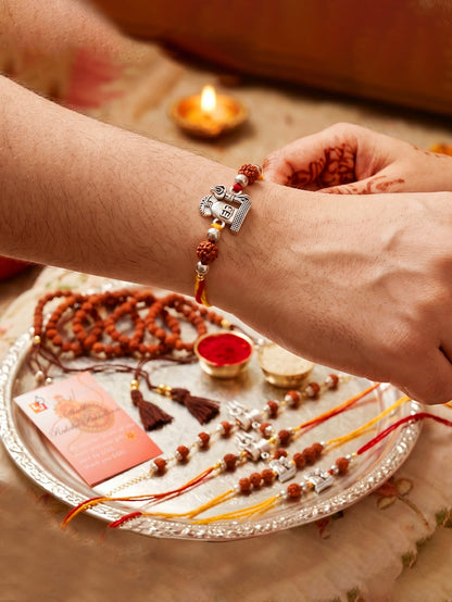 Set of 5 Rudraksha & Silver Trishul Rakhi Set: Shiva-Themed, Metallic Accents, Roli, Chawal & Card (718-JPR1-1994-5-2026)