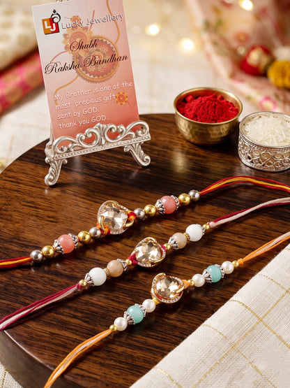 Set of 3 Designer Rakhis: Faceted Crystal Centerpiece & Multi Beads, Roli, Chawal & Card (300-CHR1-1002B-3-2026)