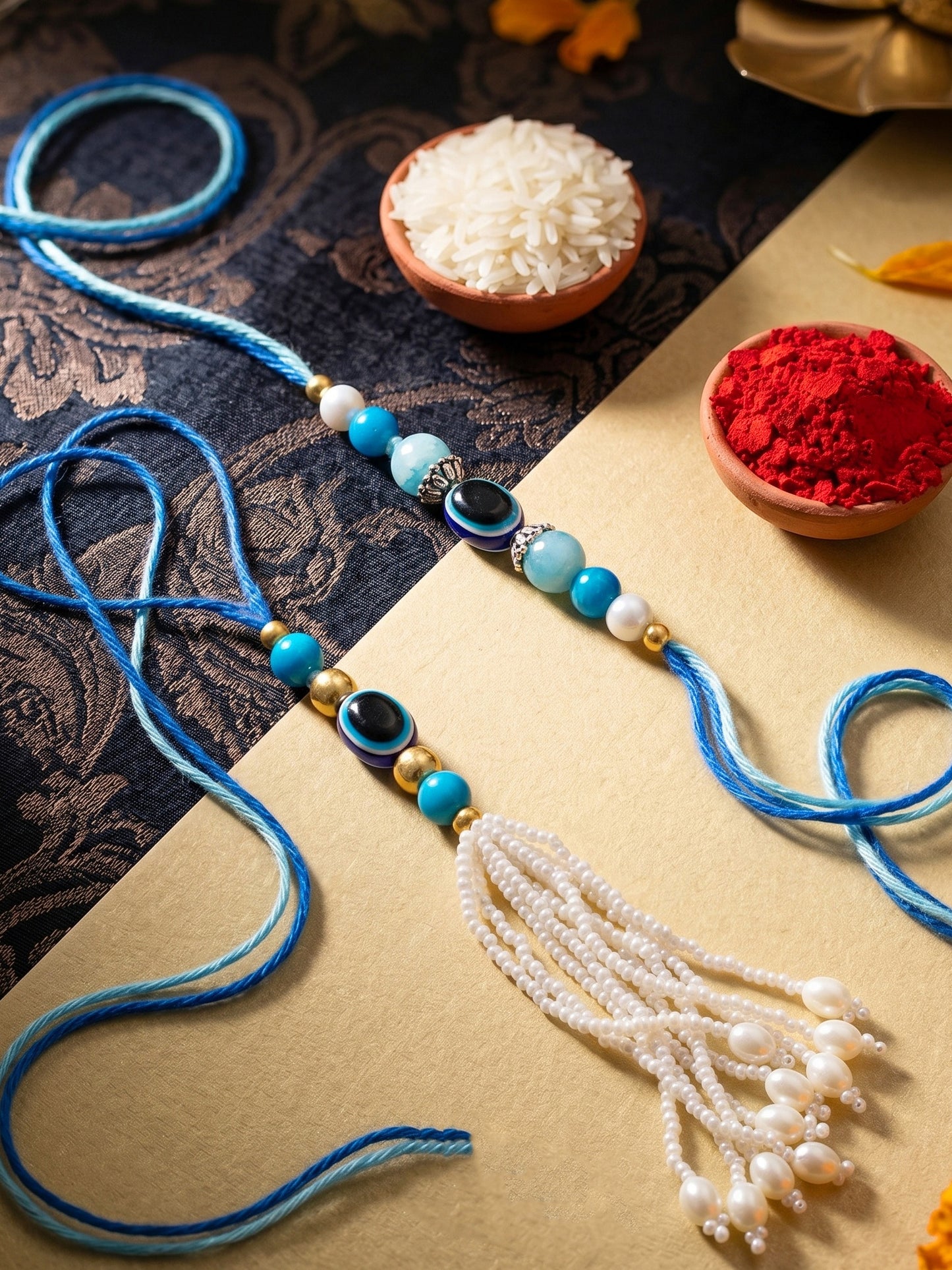 Set of 2 Bhaiya Bhabhi Evil Eye Rakhi Set with Blue & White Beads, Lumba Tassel, Roli Chawal & Card (72-J5R1-1992-EE-2-2026)
