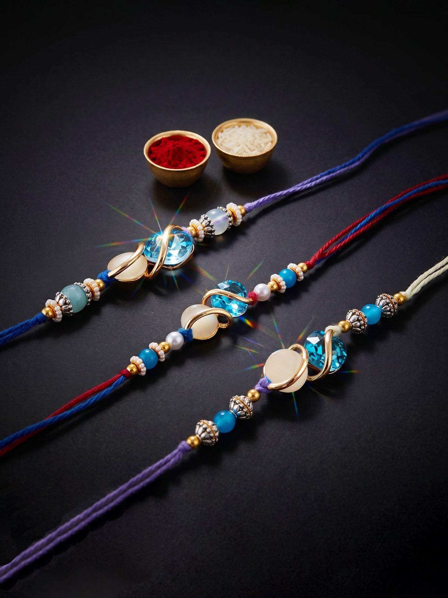 Designer Rakhi Set of 3: Blue Crystal, Cream Stone, Metallic Spacers, Roli, Chawal & Card (300-CHR1-1002A-3-2026)