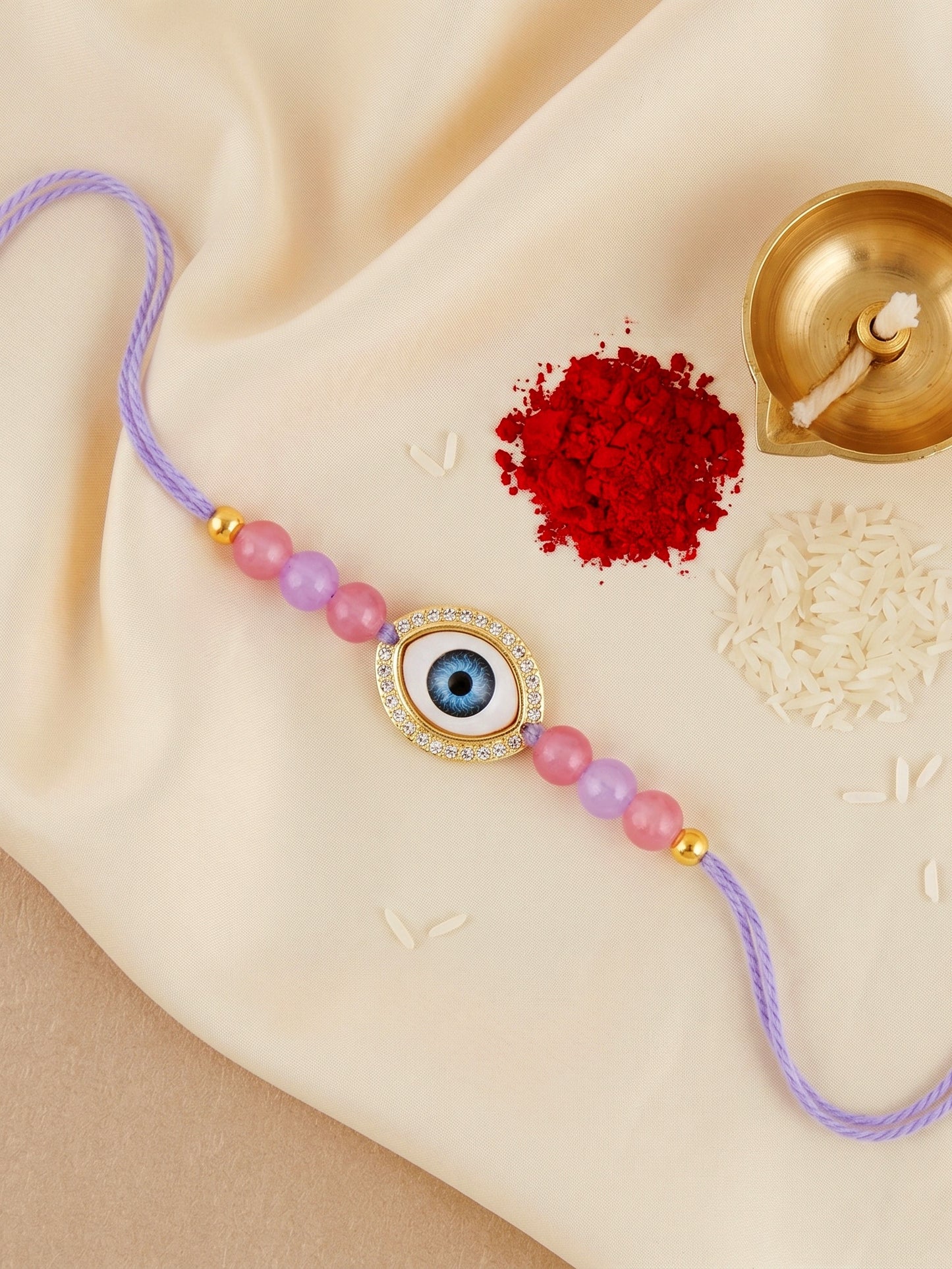 Evil Eye Rakhi for Brother. Protective Charm with Pastel Beads, Roli, Chawal & Card (265-CHR1-1191-P-1-2026)