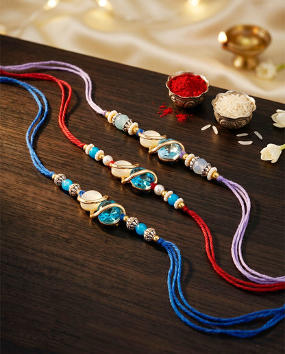 Designer Rakhi Set of 3: Blue Crystal, Cream Stone, Metallic Spacers, Roli, Chawal & Card (300-CHR1-1002A-3-2026)