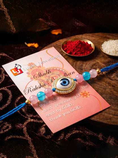 Evil Eye Rakhi for Brother. Protective Charm with Pink & Blue Beads, Roli, Chawal & Card (265-CHR1-1191-F-1-2026)