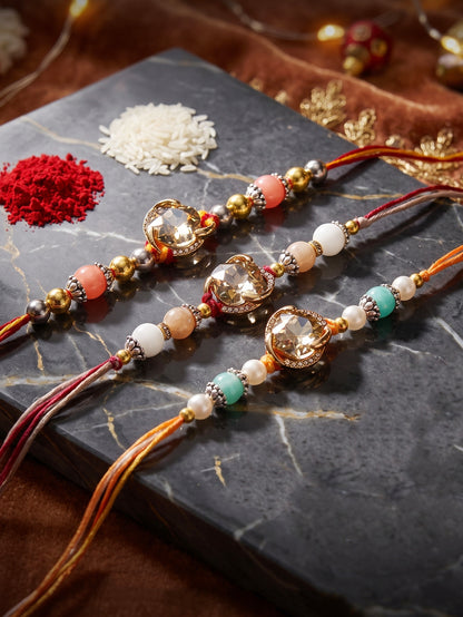 Set of 3 Designer Rakhis: Faceted Crystal Centerpiece & Multi Beads, Roli, Chawal & Card (300-CHR1-1002B-3-2026)