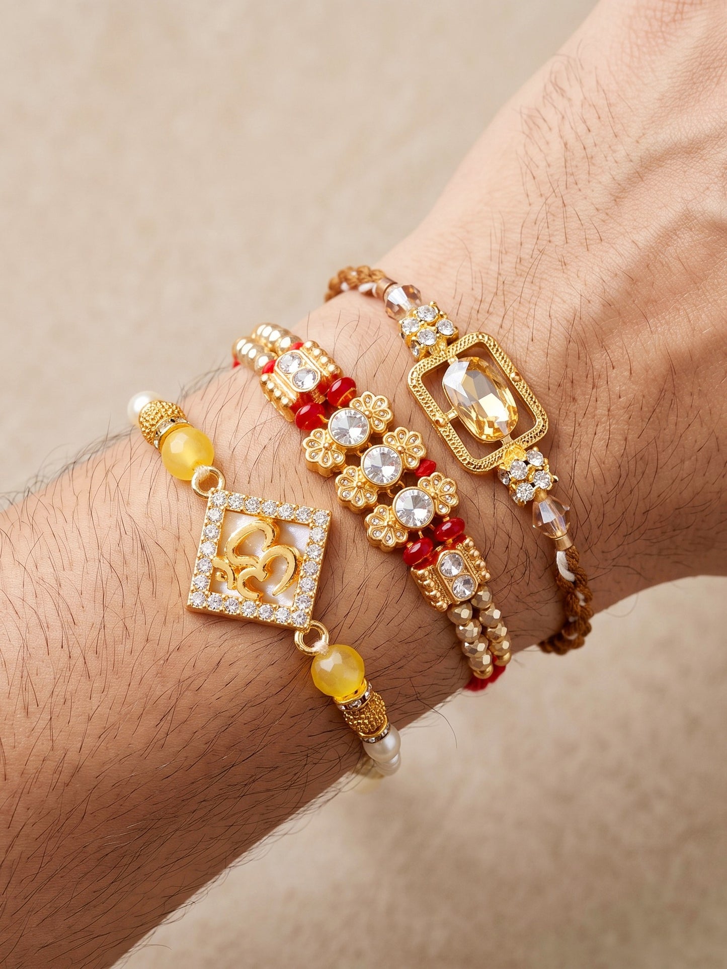 Lucky Jewellery Set of 3 Rakhi with Om & Crystal Pendants, Smooth White Beads, Roli Chawal & Card (160-S7R1-2321-3)