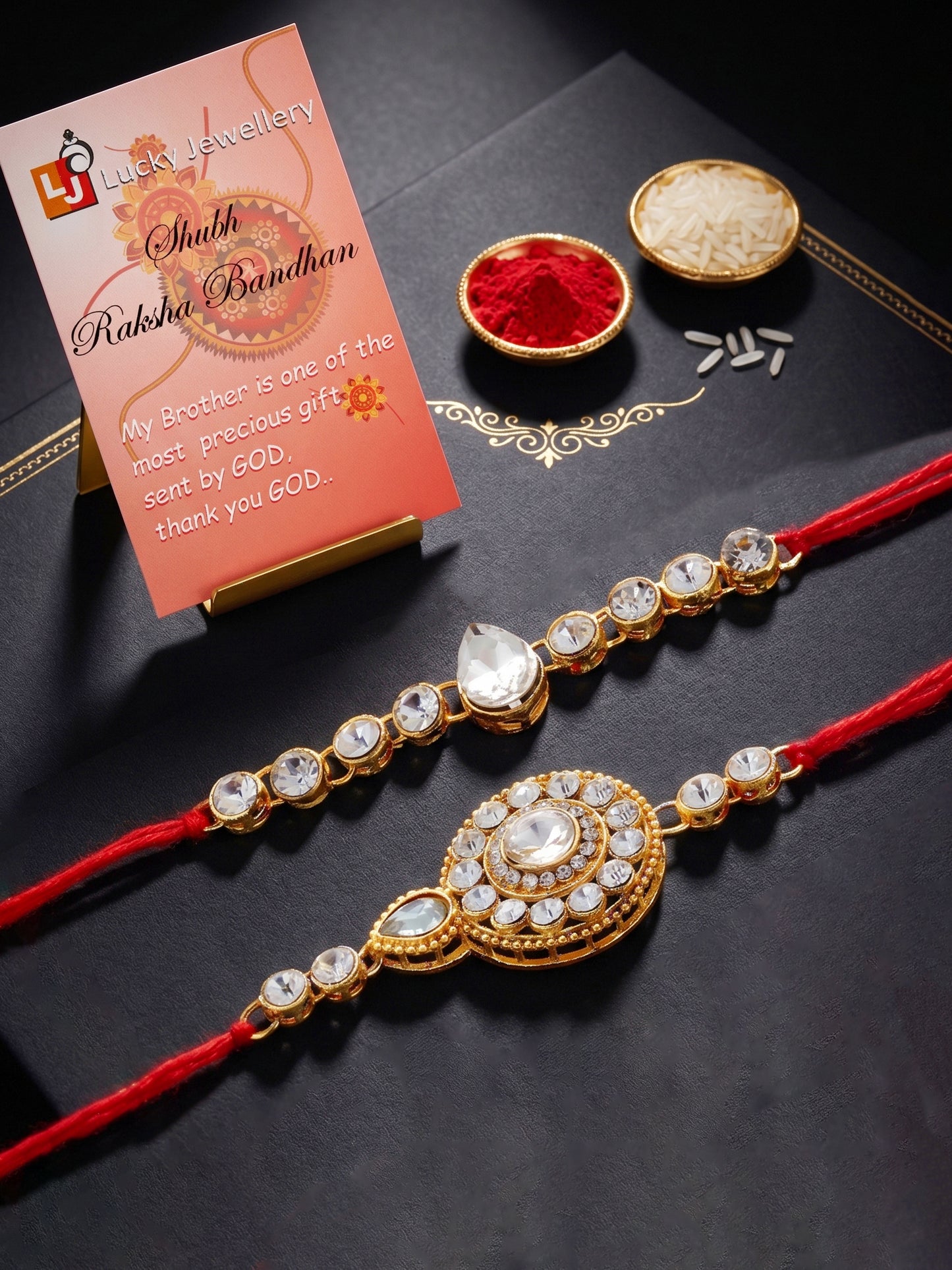 LUCKY JEWELLERY Traditional Rakhi for Brother/Bhaiya – Gold Plated Red Thread Rakshabandhan Rakhie White Stones for Bhai/Bhabhi (Pack of 2) – Fancy Rakhee Bracelet Rakshasutra (159-L1R1-21-W-2-2026)