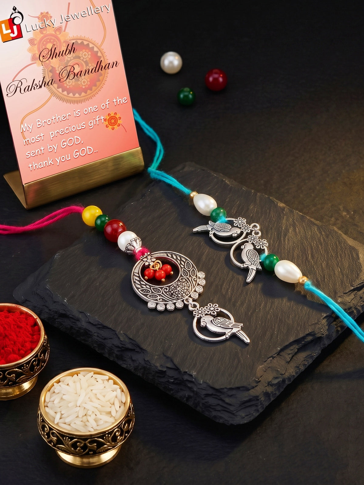 Set of 2 Bhaiya Bhabhi Rakhi Set with Small Bird Pendant, Maroon & Drop Beads, Roli Chawal & Card (108-JPCR1-1952-S-2-2026)