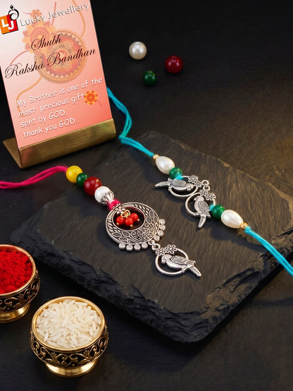 Set of 2 Bhaiya Bhabhi Rakhi Set with Small Bird Pendant, Maroon & Drop Beads, Roli Chawal & Card (108-JPCR1-1952-S-2-2026)