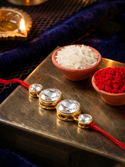 LUCKY JEWELLERY Traditional Rakhi for Brother/Bhaiya – Gold Plated Red Thread Rakshabandhan Rakhie in White Stones for Bhai/Bhabhi (Pack of 1) – Fancy Rakhee Bracelet Rakshasutra (76-L1R1-10-W-1-2026)