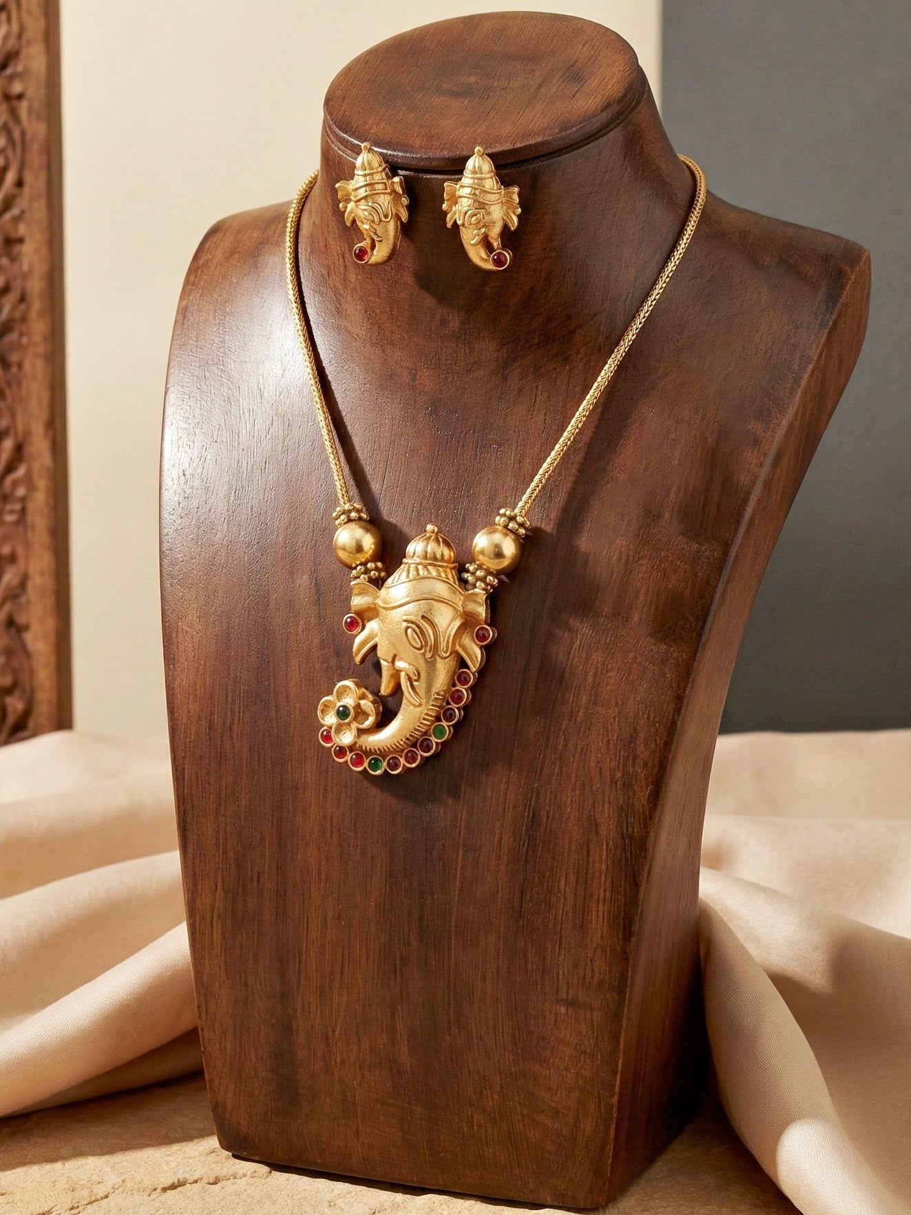 Traditional Gold-Tone Lord Ganesha Necklace Set with Pink & Green Stone Detailing | Temple Style Ethnic Jewellery with Stud Earrings for Festive & Wedding Wear (590-ISR-2181-RG)