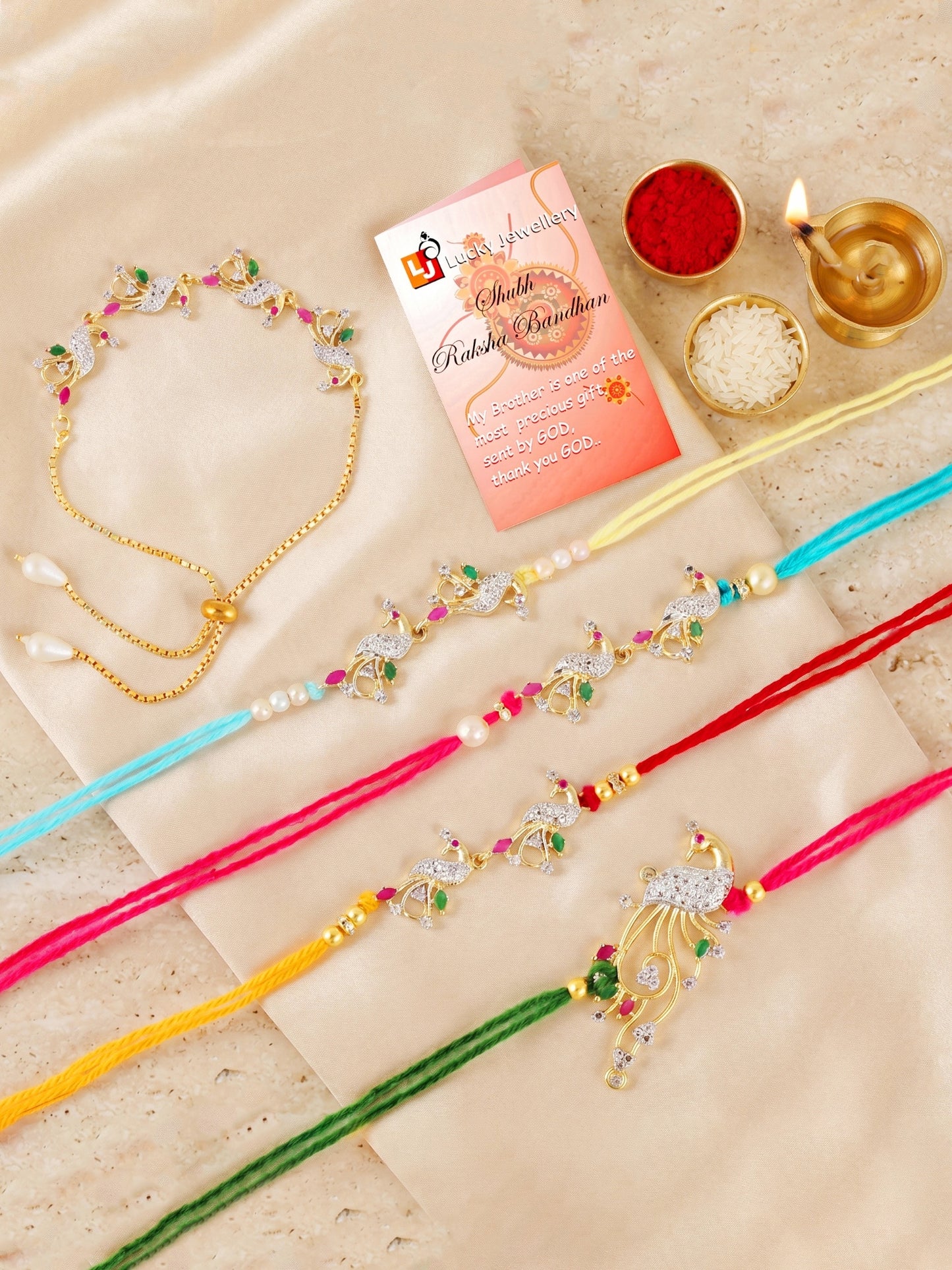 Set of 5 Designer Gold-Toned Peacock Rakhi Set for Brother & Bhabhi, Roli, Chawal & Card (680-P4R1-1544-5-2026)