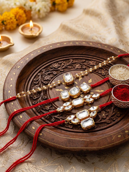 LUCKY JEWELLERY Traditional Rakhi for Brother/Bhaiya – Gold Plated Red Thread Rakshabandhan Rakhie White Stones for Bhai/Bhabhi (Pack of 4) – Fancy Rakhee Bracelet Rakshasutra (182-L1R1-18-W-4-2026)