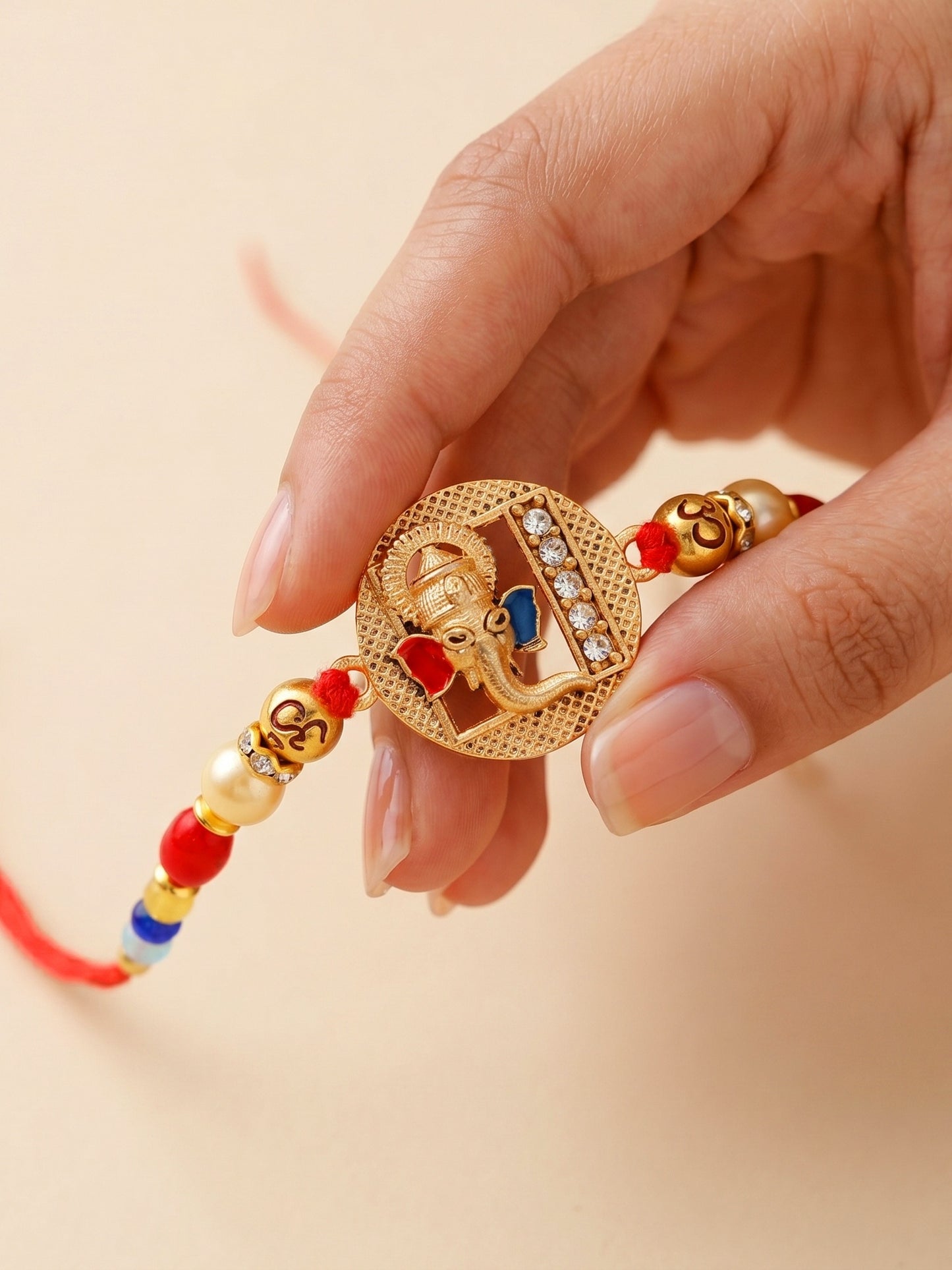 Divine Lord Ganesha & Spiritual Om Beaded Rakhi Set For Brother | With Roli Chawal & Greeting Cards (72-S5R1-AR2922)