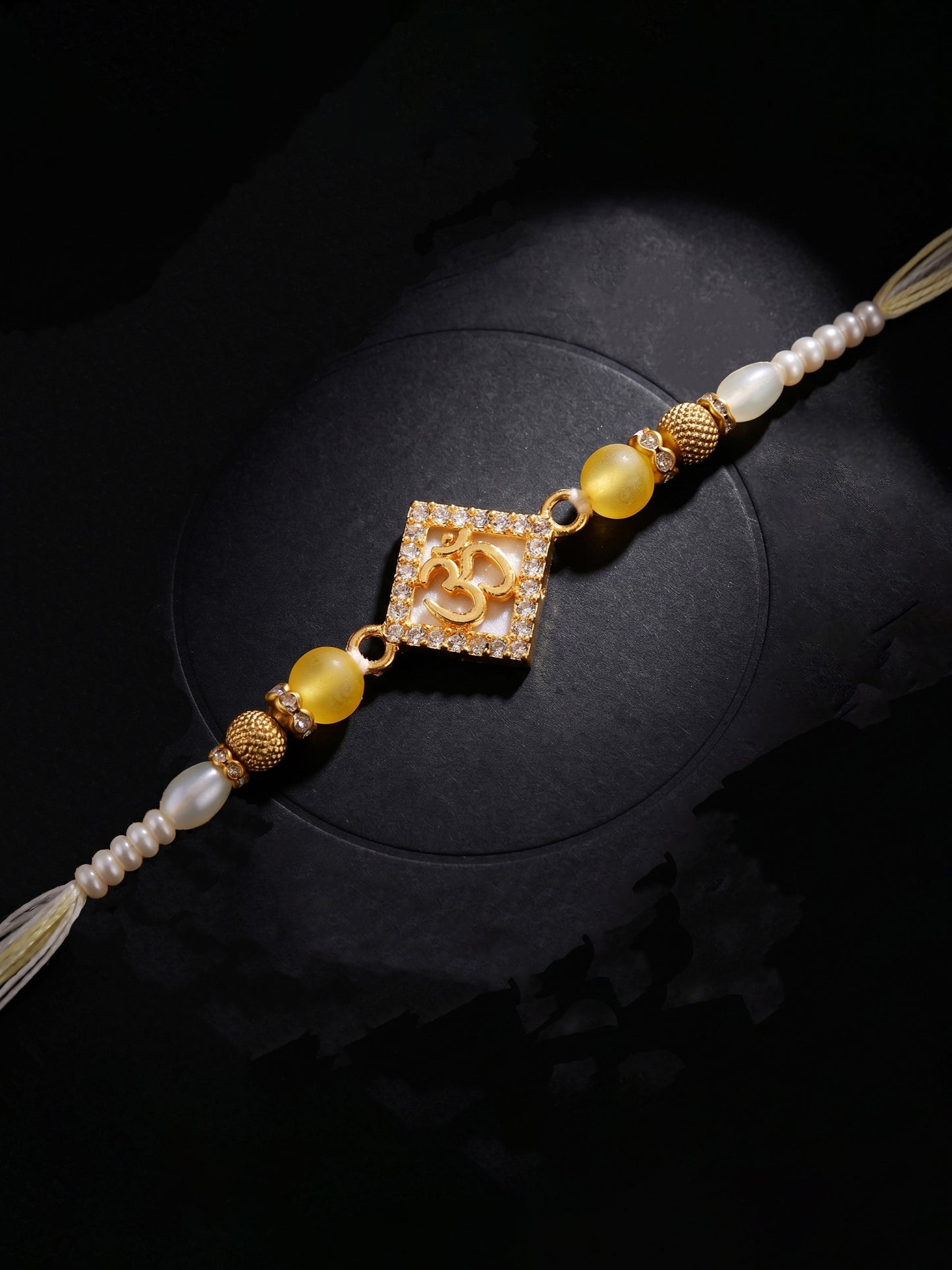 Designer Square Om Rakhi For Brother With Roli Chawal And Card | Gold-Tone Rhinestone Studded Rakhi (100-S7R1-IO3801)