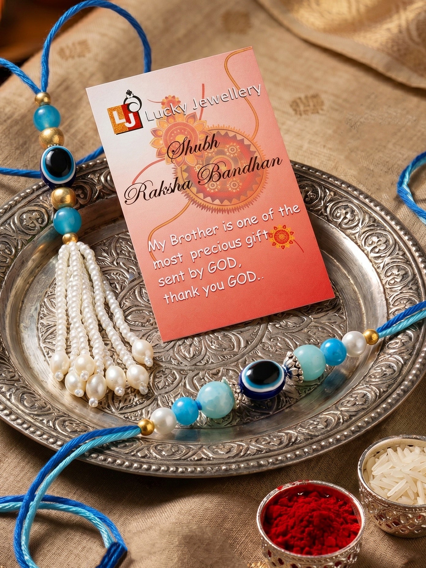 Set of 2 Bhaiya Bhabhi Evil Eye Rakhi Set with Blue & White Beads, Lumba Tassel, Roli Chawal & Card (72-J5R1-1992-EE-2-2026)