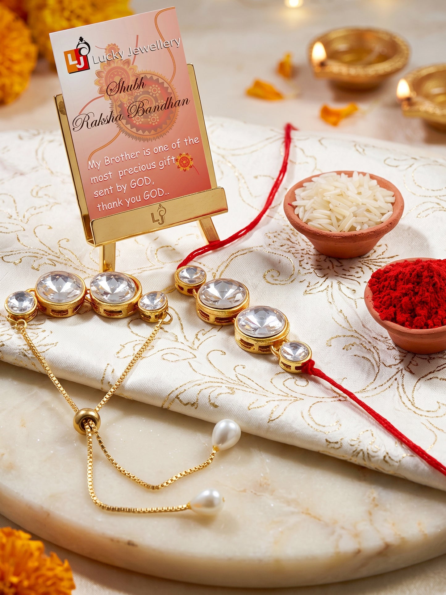 LUCKY JEWELLERY Rakhi for Brother/Bhaiya – Gold Plated Red Thread Rakshabandhan Rakhie in White Stones for Bhai/Bhabhi (Pack of 2) – Rakhee Bracelet with Pull Chain Rakshasutra (152-L1R1-10B-W-2-2026)