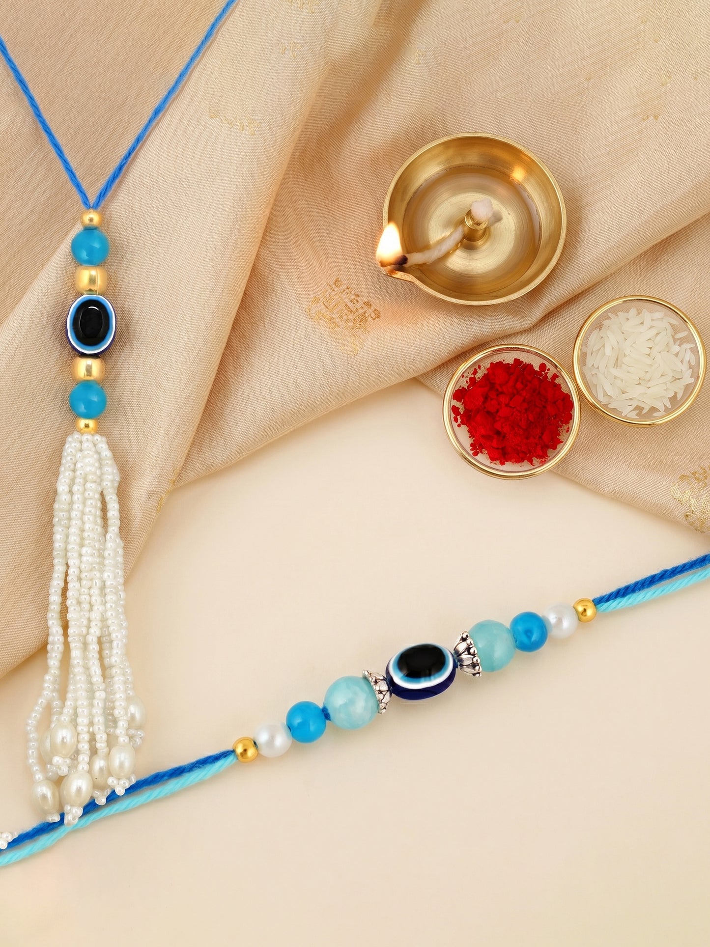Set of 2 Bhaiya Bhabhi Evil Eye Rakhi Set with Blue & White Beads, Lumba Tassel, Roli Chawal & Card (72-J5R1-1992-EE-2-2026)
