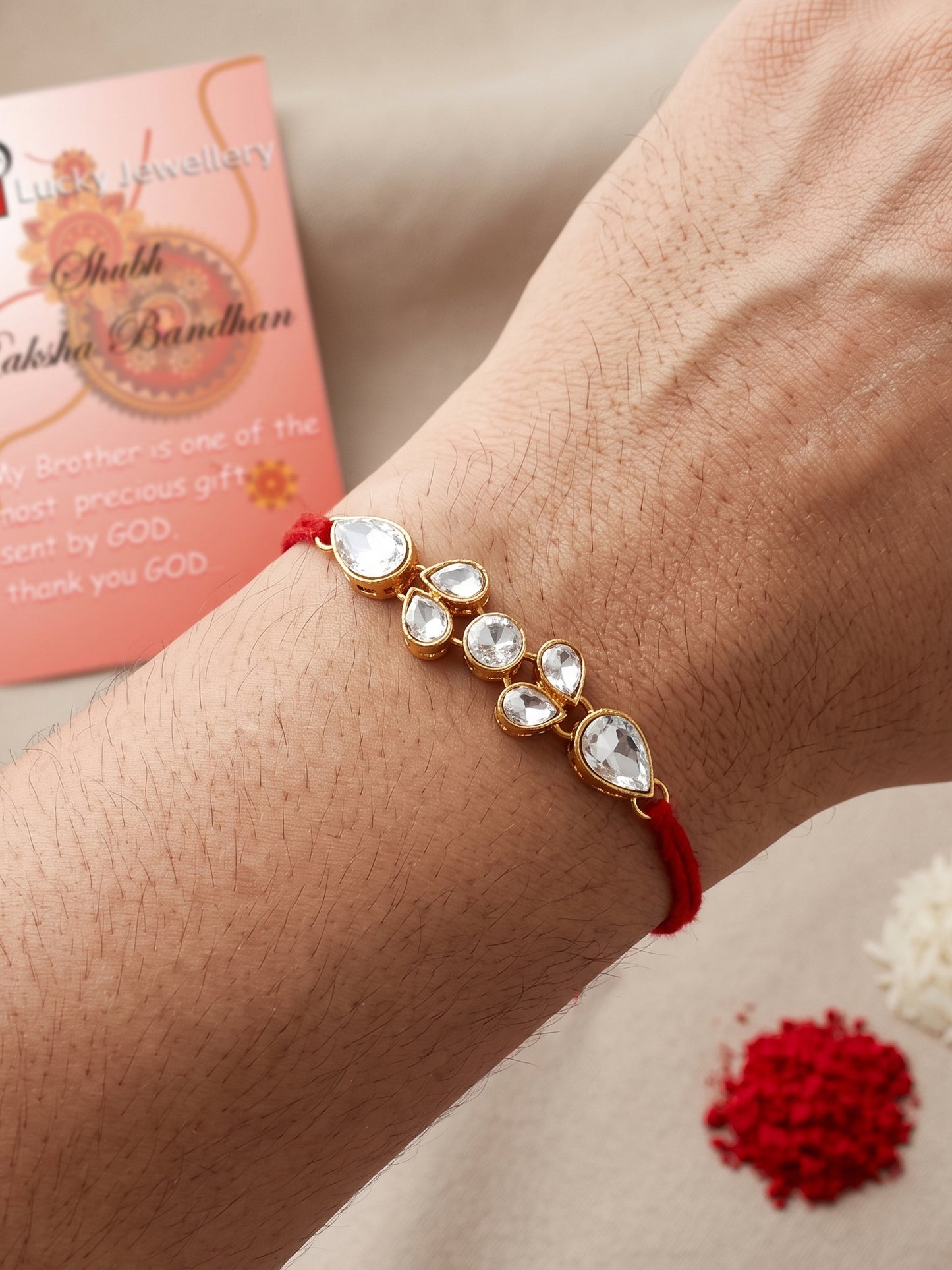 LUCKY JEWELLERY Traditional Rakhi for Brother/Bhaiya – Gold Plated Red Thread Rakshabandhan Rakhie White Stones for Bhai/Bhabhi (Pack of 2) – Fancy Rakhee Bracelet Rakshasutra (159-L1R1-07-W-2-2026)